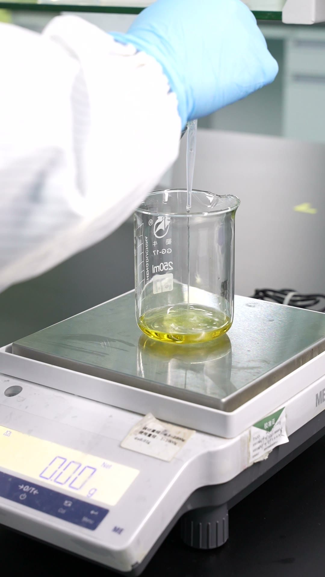 Fragrance oil weighed on a lab balance