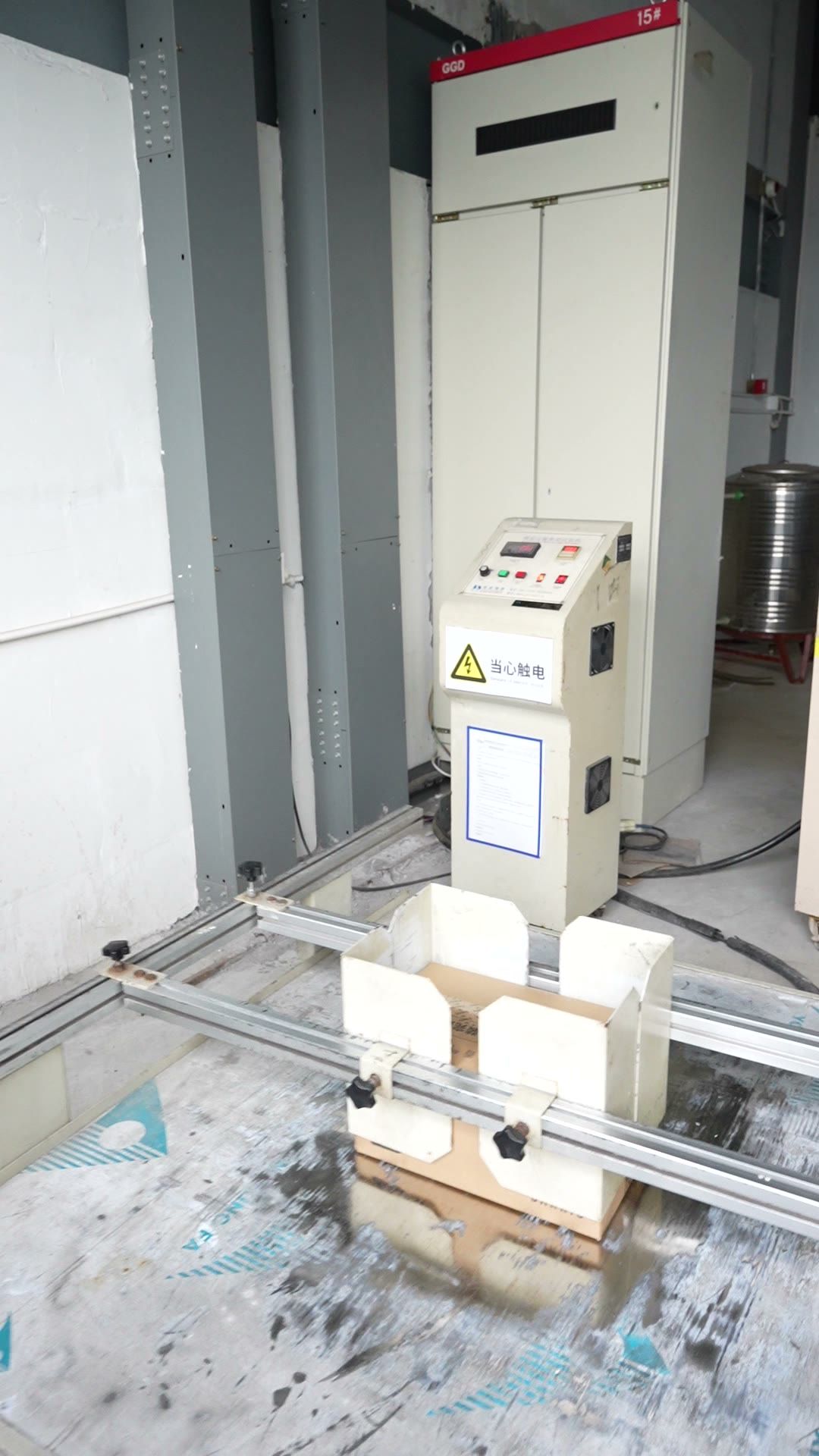 Packed cartons on a simulated transport test rig